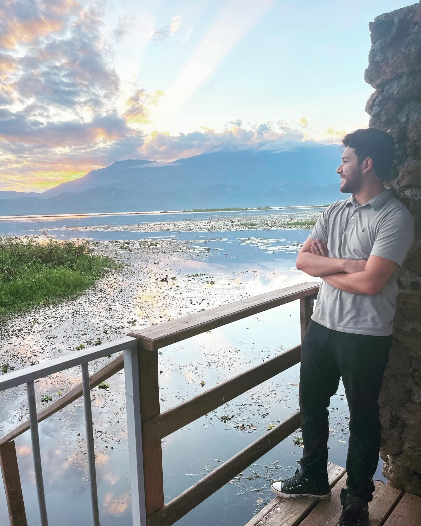 Pablo Novelo, Founder of Frontend Horizon, on a deck overlooking a lake at sunset